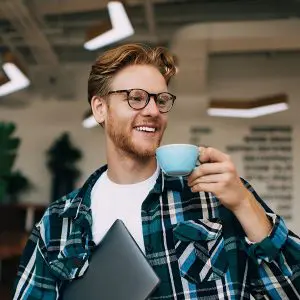 Image of an office worker drinking an espresso