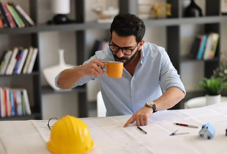 Image of an office worker drinking a mug of tea