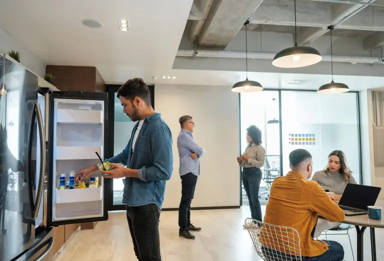 Image of office workers in a breakroom area