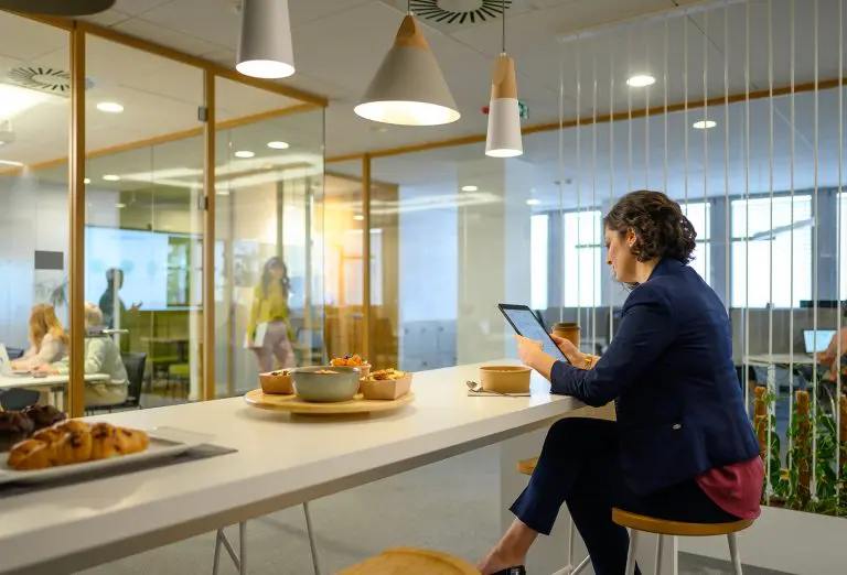 Image of an office worker in a breakroom area