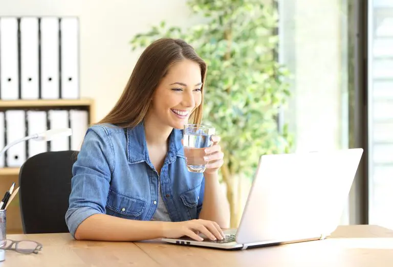 Image of an office worker drinking water