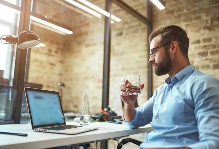 Image of an office worker drinking water